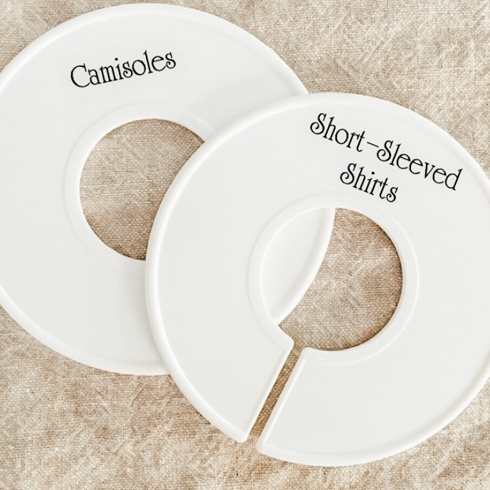 Image Description: Close up on two labeled clothing rod dividers