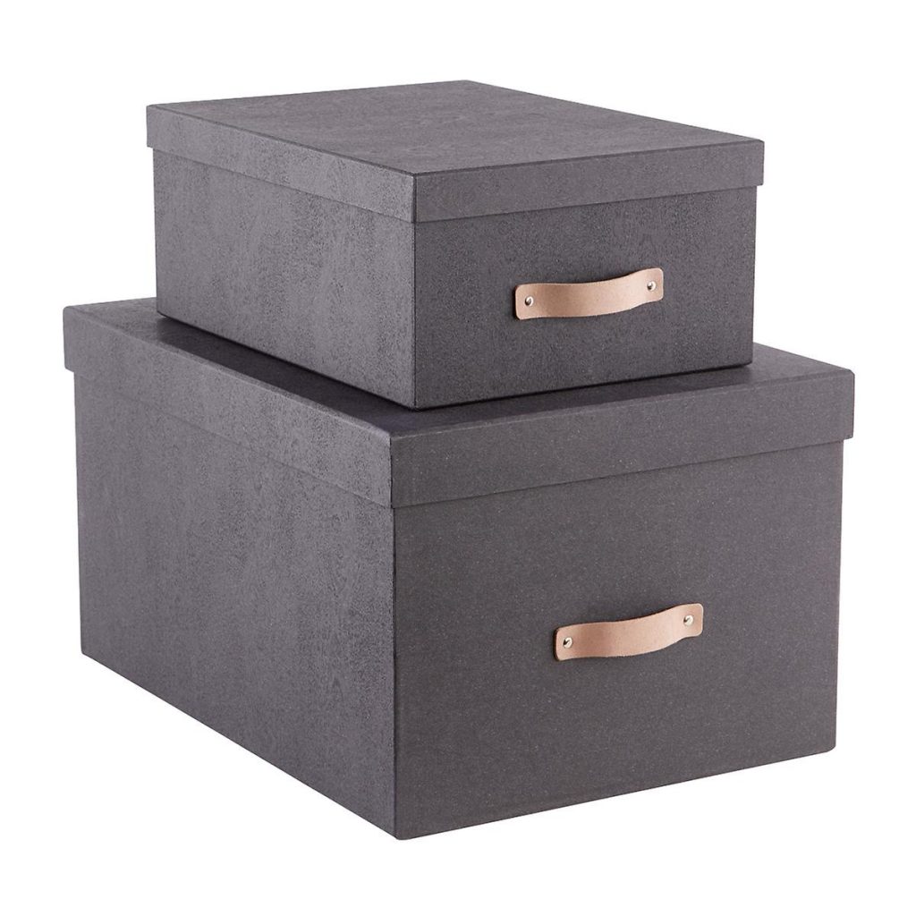 Image Description: Stacked matte black linen boxes against a white background