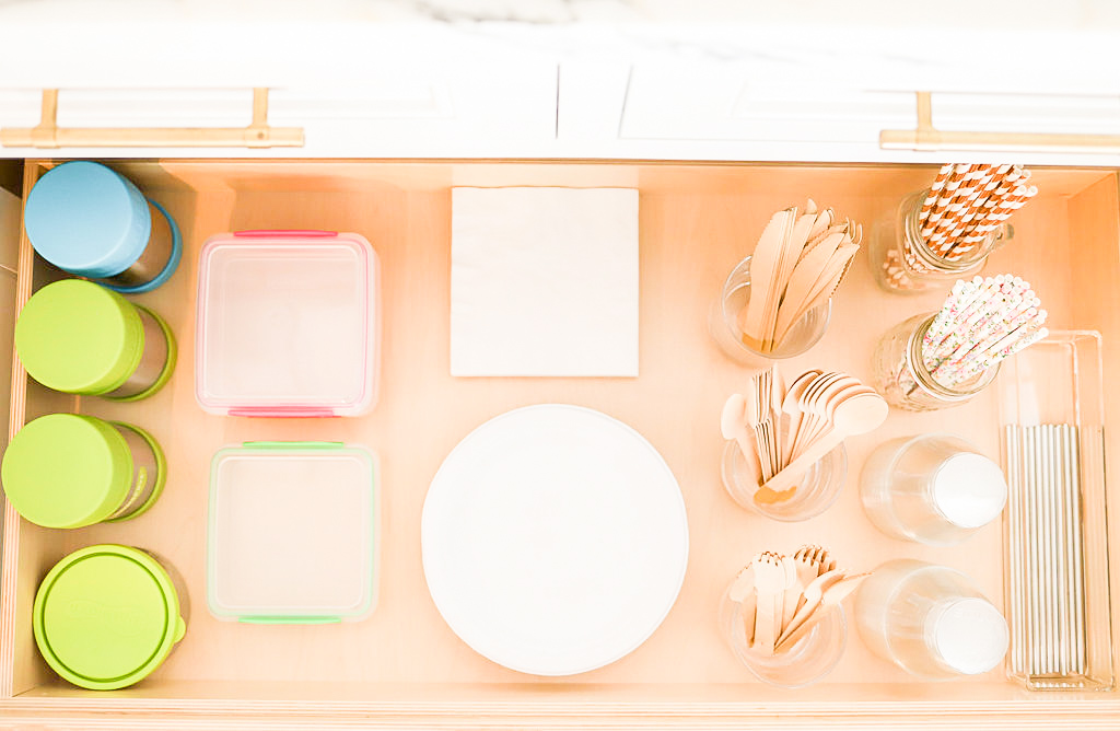 Image Description: A set of wooden and colorful picnic and party supplies in a drawer