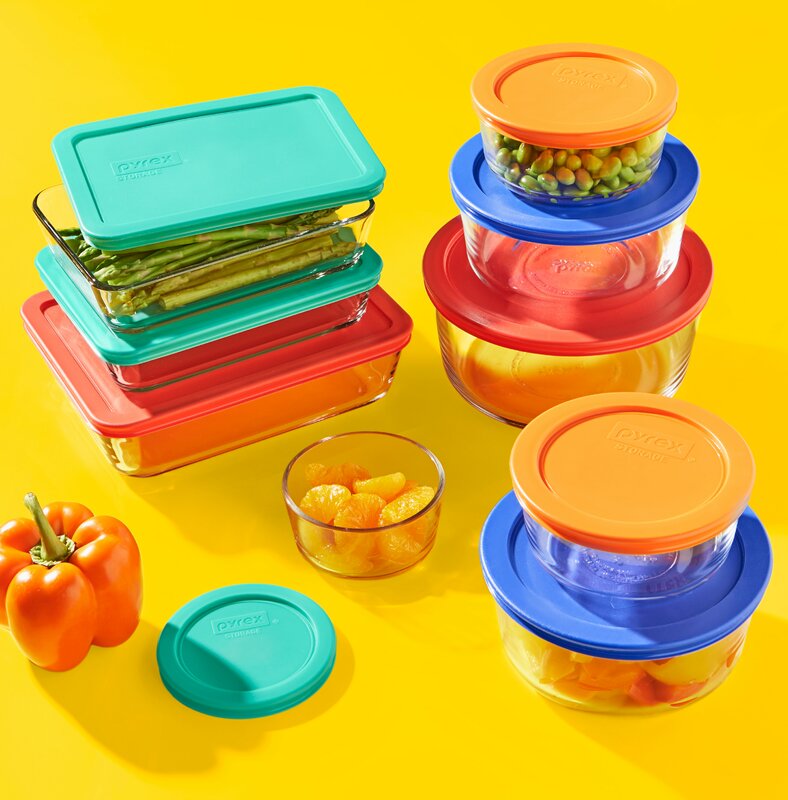 Image Description: A set of colorful pyrex glass containers on a bright yellow background