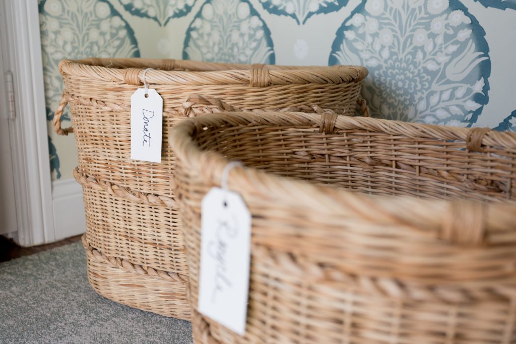 Image Description: A close up on two wicker baskets with labels that say "Donate" and "Recycle"